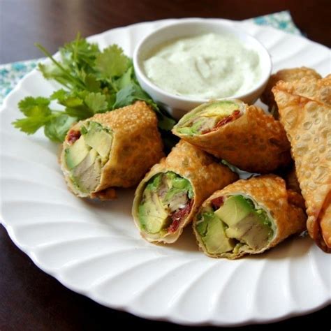 The avocado filling is just avocados, sun dried tomatoes, onions and cilantro with a bit of pepper, so most of the pops of flavor come from the sauce ingredients. Avocado Egg Rolls with Creamy Cilantro Ranch Dip | Recipe ...