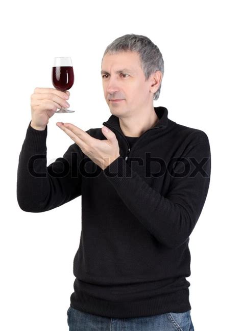 The glass industry of the country had already reached great success by becoming the largest producer in the world. Man holding a glass of red port wine | Stock Photo | Colourbox
