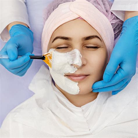 Spa Therapy For Young Woman Receiving Facial Mask At Beauty Salon Stock Image Image Of