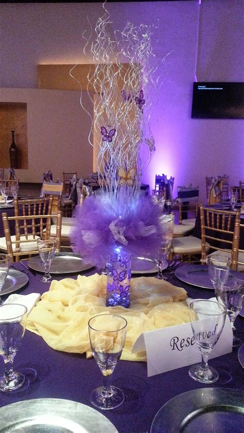 Nieces Quinceanera Small Centerpiece Using Purple Tulle Silver Sticks