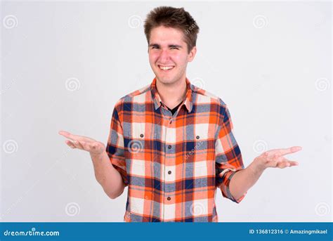 Happy Young Handsome Man Shrugging Shoulders Against White Background