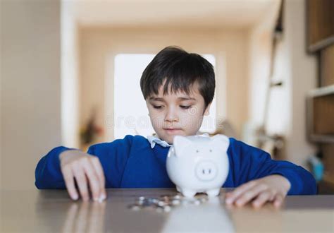 School Kid Putting Coins Into Piggy Bank Child Boy Counting Saving