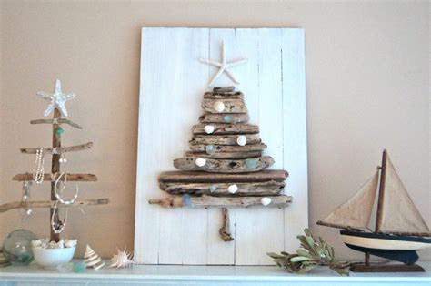 A christmas tree with pretty fairy lights on the beach in australia with soft. beachcomber: beach christmas