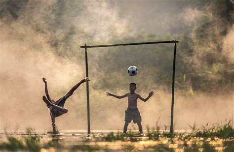 Two Boys Playing Soccer Hd Wallpaper Wallpaper Flare