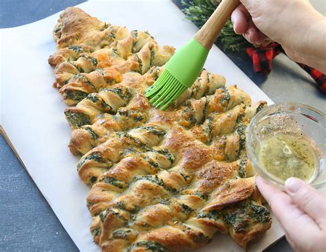 This version is oven baked and incredibly easy to make. Christmas tree spinach dip breadsticks - It's Always Autumn