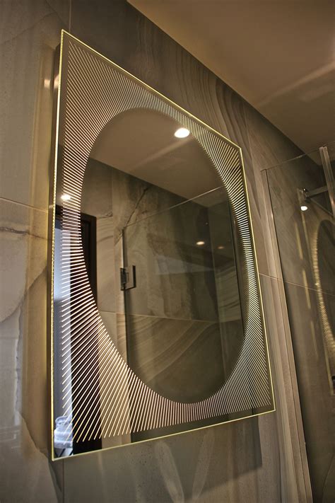 Mirrored cabinets are fantastic design elements for any bathroom décor. Oval Sunrise™ Frameless Illuminated Mirror | Illuminated ...