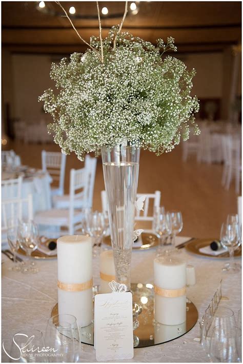 Beautiful Centre Piece Candles And Babys Breathe Winter Wedding