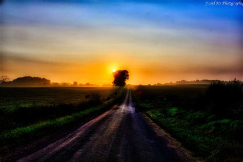 Early Morning Sunrise On A Country Road Country Roads Morning