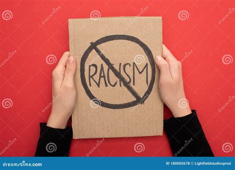 Cropped View Of Woman Holding Carton Placard With Stop Racism Sign