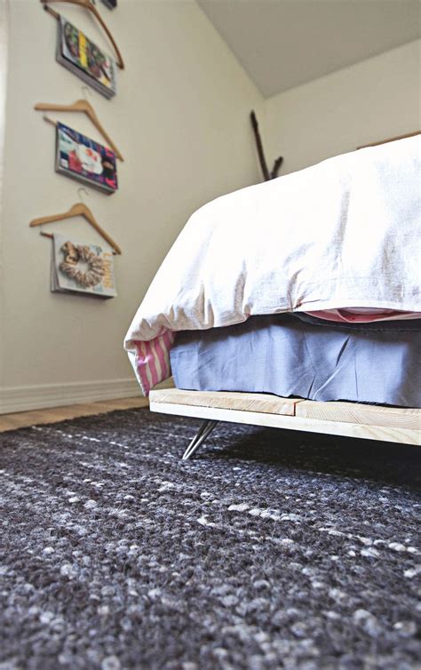 Diy sliding dog gate from reclaimed futon frame. 21 DIY Bed Frames To Give Yourself The Restful Spot of Your Dreams!