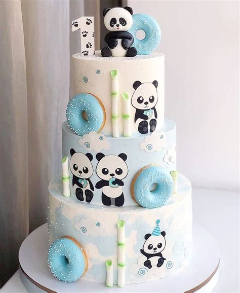 A Three Tiered Cake Decorated With Donuts And Panda Bears