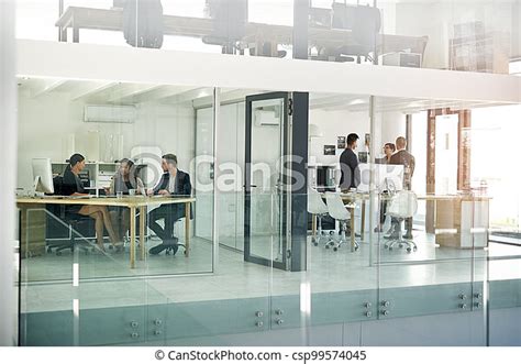 The Inner Workings Of A Modern Office Full Length Shot Of Two Groups