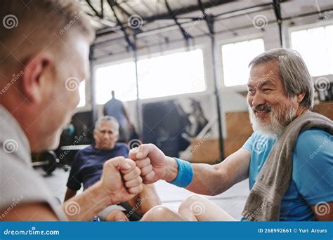 Fitness Gym And Men With Fist Bump For Senior Support Personal Trainer Goals And Exercise