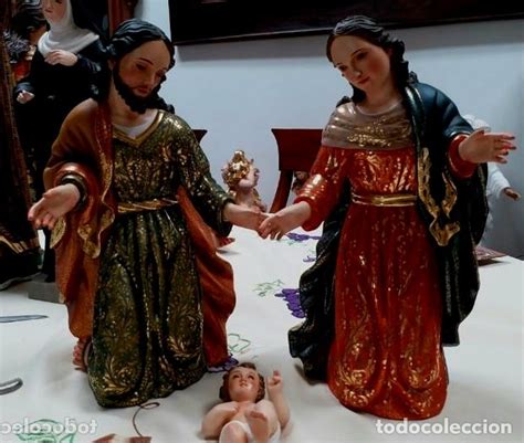 Bonita pieza tallada en madera de san jose con niñoel niño sujeta una cesta con frutas y san jose una bara toda figura es totalmente de madera. escultura sagrada familia madera san jose niño - Comprar ...
