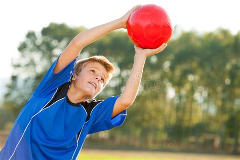 Young Boy Catching Red Ball Outdoors Stock Image Image Of Movement