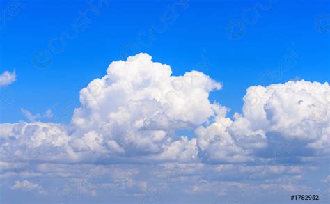White Fluffy Clouds Against The Blue Sky Stock Photo Crushpixel