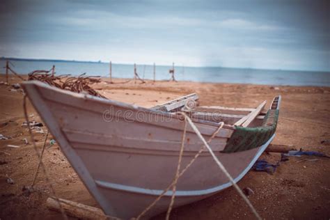 White Blue Traditional Boat On Sandy Beach Wooden Boat On Beach