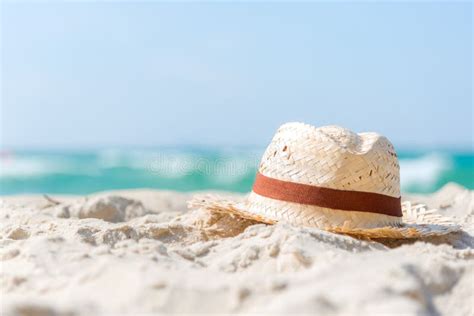 Closeup Of Summer Beach Straw Hat On Sandy Beach In Vacations Stock