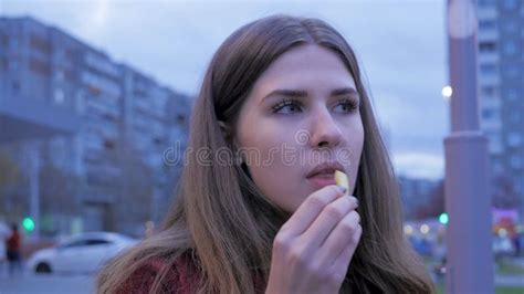 A Young Girl Has Dinner Fast Food In The Town Square Young Woman