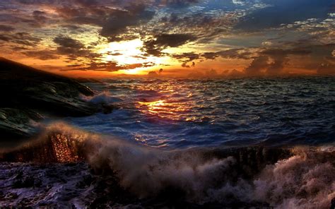 Sunset On A Stormy Sea Wallpapers And Images Wallpapers Pictures Photos