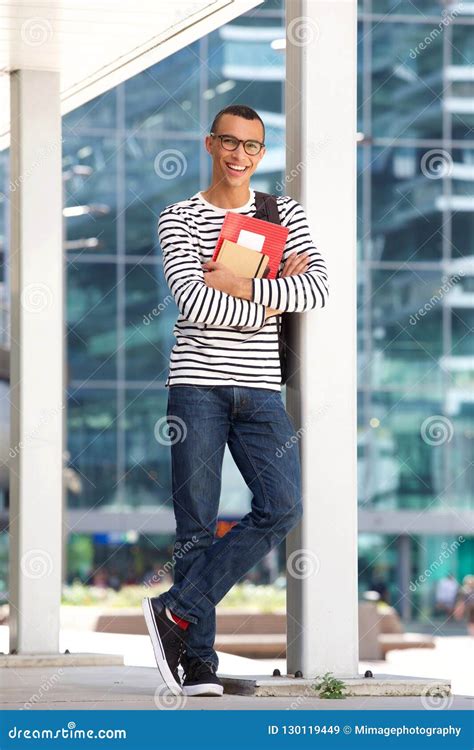 Full Body Smiling Male College Student Standing At Campus Stock Image