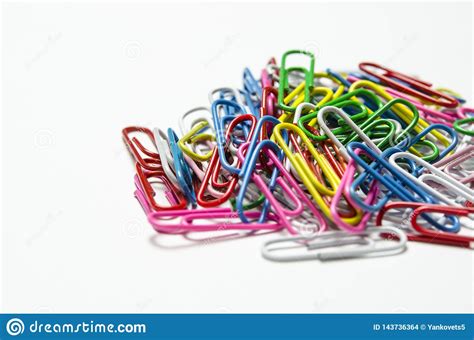 Colorful Paper Clips To Documents Lying On A White Background Stock