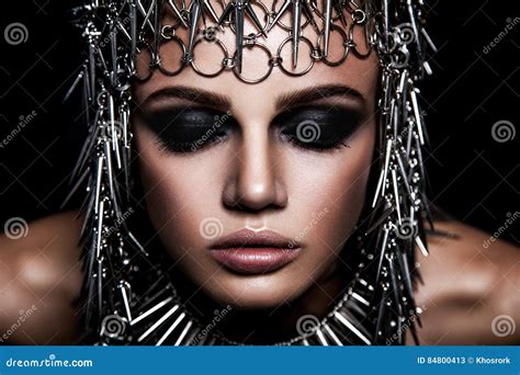 High Fashion Beauty Model With Metallic Headwear And Dark Makeup And