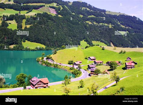 Houses With Lake And Mountain View In Lungern In Switzerland Stock