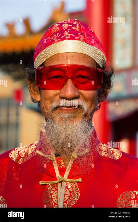 Portrait Old Chinese Man With Red Glasses Hat And Beard Chinese