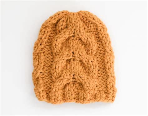 The hoodie shape perfect covers your ears to keep you warm all winter long. How To Knit A Cable Hat - Golden Waves Toque - Mama In A ...