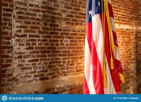 American Flag On Stand Against Old Brick Wall Stock Photo Image Of