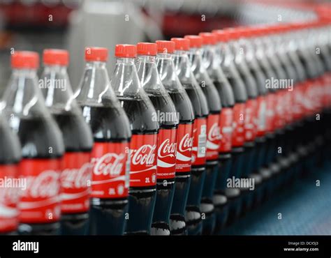 Two Liters Coca Cola Bottles Are Pictured On The Production Line In