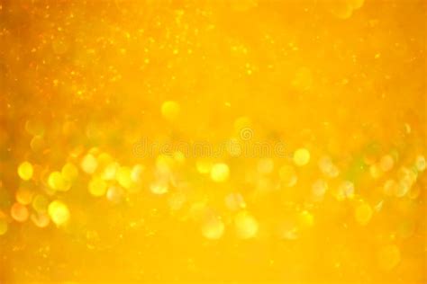 The Blurred Texture Of The Golden Shine Background With Gold Glitter