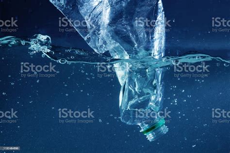 A Plastic Water Bottle Pollution In Ocean Stock Photo Download Image
