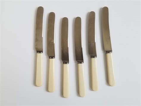 Vintage Cheese Knives By Walker And Hall Off White Patterned Bakelite