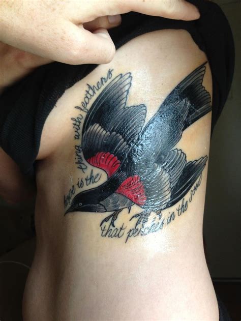 A Woman With A Tattoo On Her Stomach Has A Bird And The Words What Do
