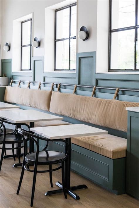 Banquet seating with leather back rest with straps and a rod + two