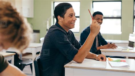 Student In Classroom Asking A Question Stock Photo 169181