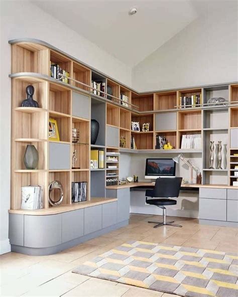 A Home Office With Built In Shelving Units
