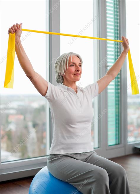 older woman stretching in gym stock image f005 4269 science photo library