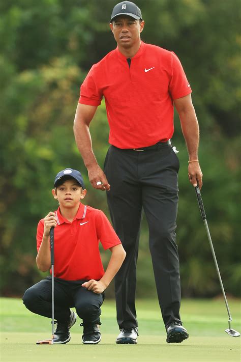 tiger woods gives son charlie 11 big hug after showing off twinning swings in first tournament