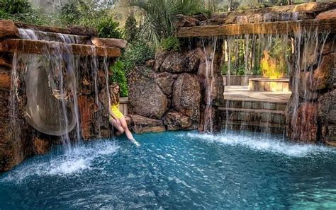 Backyard Pool With Rock Waterfall And Slide Backyard Landscaping Ideas
