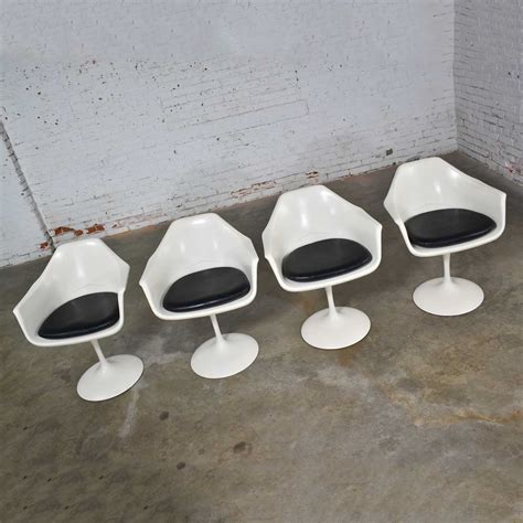 Original saarinen tulip set in excellent condition. Tulip Style White Fiberglass Swivel Chairs and Table by ...
