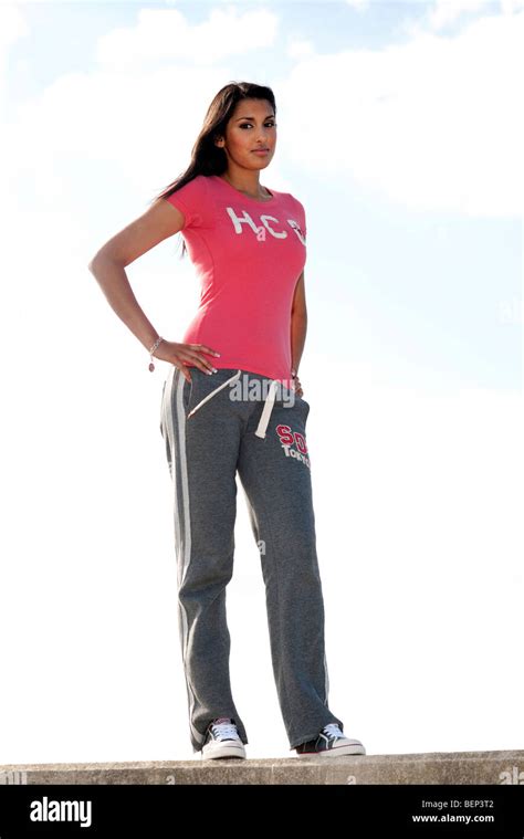 Woman Standing With Hands On Hips Stock Photo Alamy