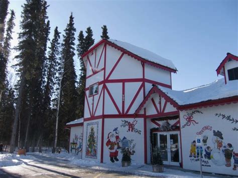 Samantha has a tattoo on the back of her neck as. santa-s-house.jpg