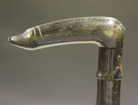 A 19th Century Sectional Horn Walking Stick With A Carved Handle And