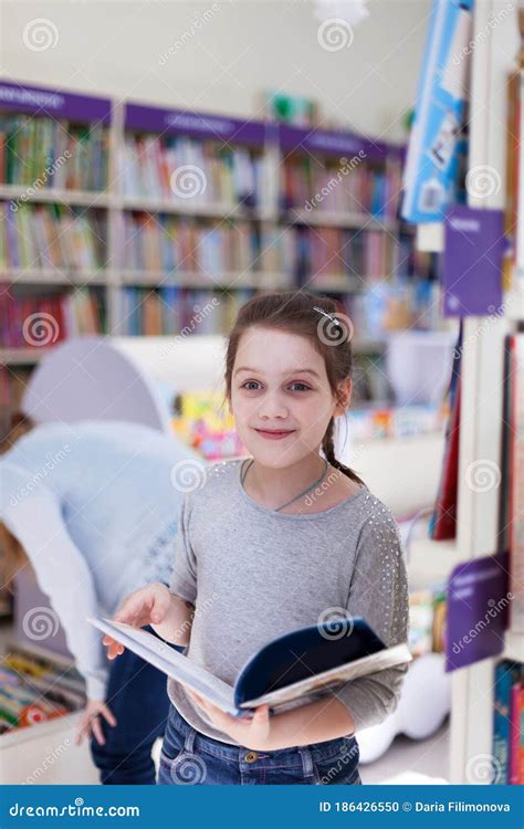 Girl Reading Book In Library Stock Photo Image Of Girl Reading
