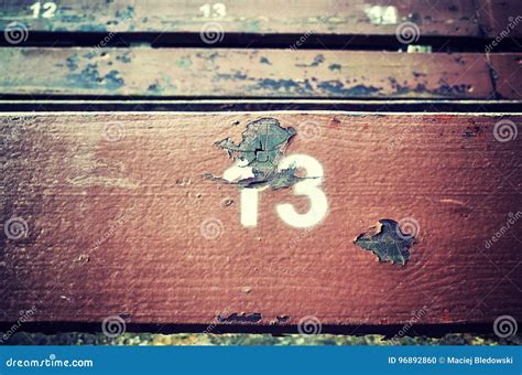Number Thirteen Painted On An Old Wooden Seat Stock Photo Image Of