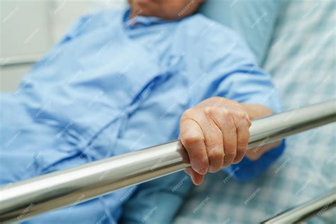 Premium Photo Asian Elder Senior Woman Patient Holding Bed Rail While