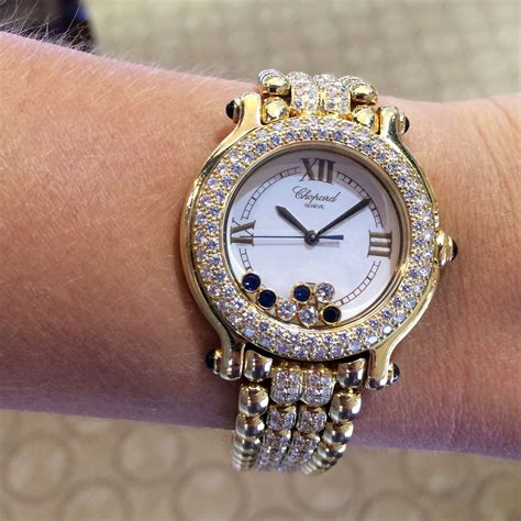 Water resistant to 30 meters. Chopard Happy Sport Gold Diamond and Sapphire Watch